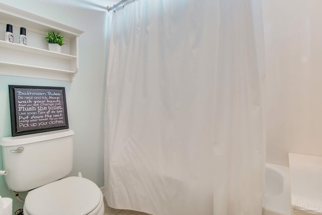 bathroom featuring shower / bathtub combination with curtain and toilet