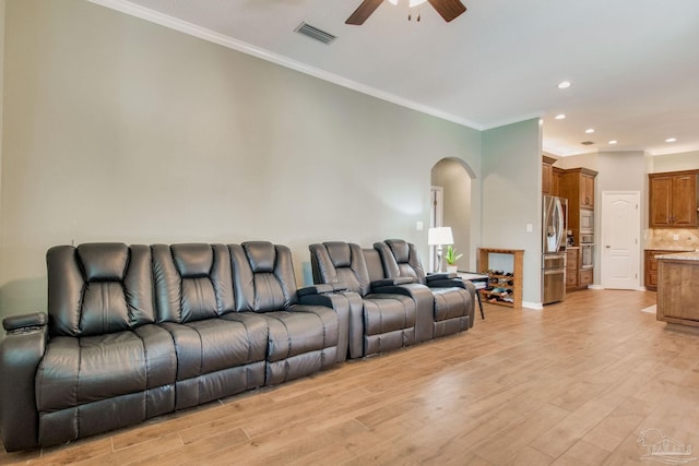 living room with ceiling fan, light hardwood / wood-style floors, and ornamental molding