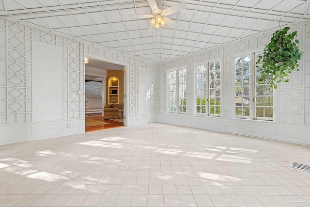 interior space featuring ceiling fan