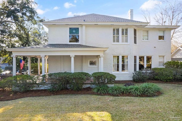 view of front of home with a front yard