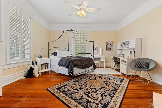 bedroom featuring wood-type flooring and ceiling fan