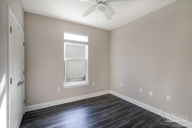 unfurnished room with dark hardwood / wood-style floors, ceiling fan, and a wealth of natural light