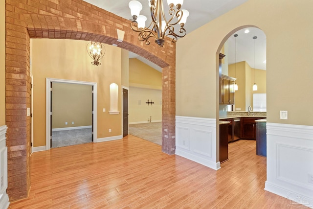 unfurnished dining area featuring light hardwood / wood-style floors and sink