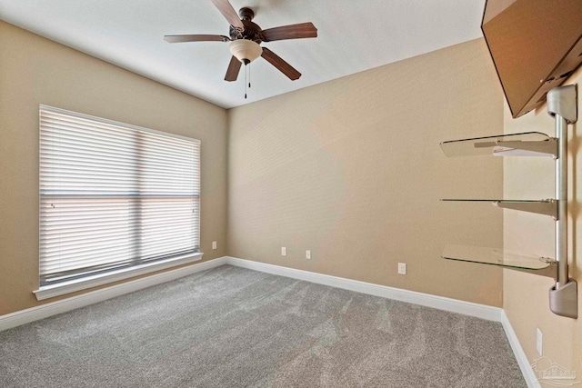 unfurnished room featuring ceiling fan and light colored carpet