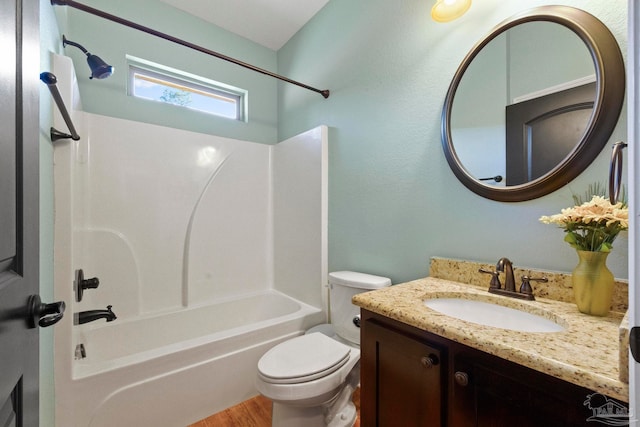 full bathroom with hardwood / wood-style floors, shower / bath combination, vanity, and toilet