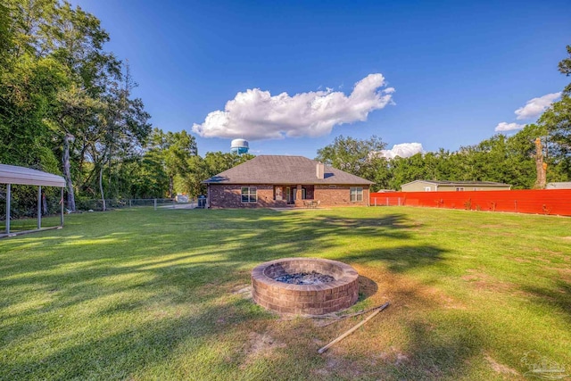 view of yard with an outdoor fire pit