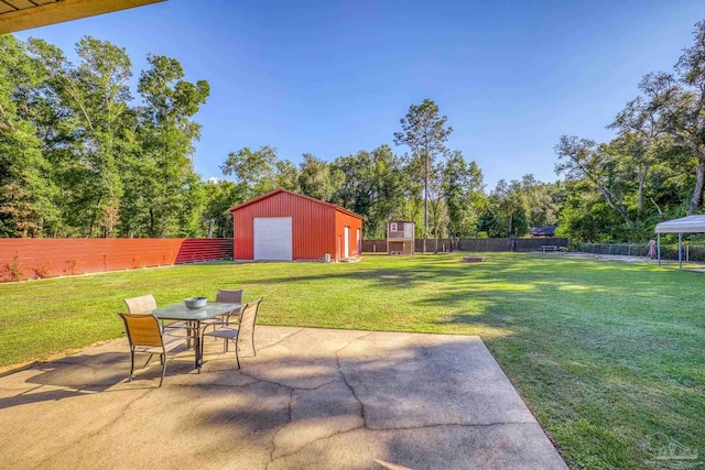 view of patio / terrace featuring an outdoor structure and a garage