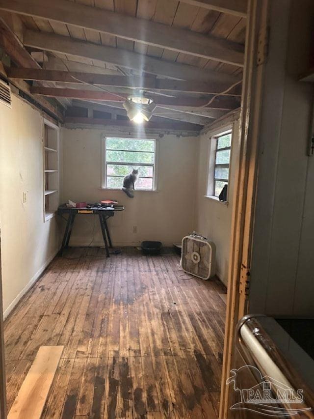 basement featuring hardwood / wood-style floors and wooden ceiling