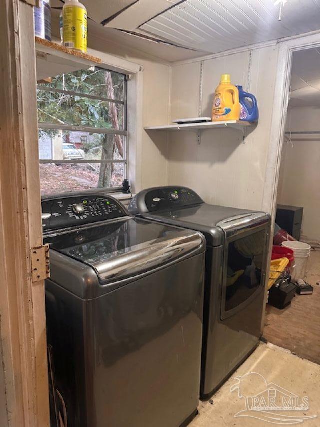 clothes washing area with washer and dryer