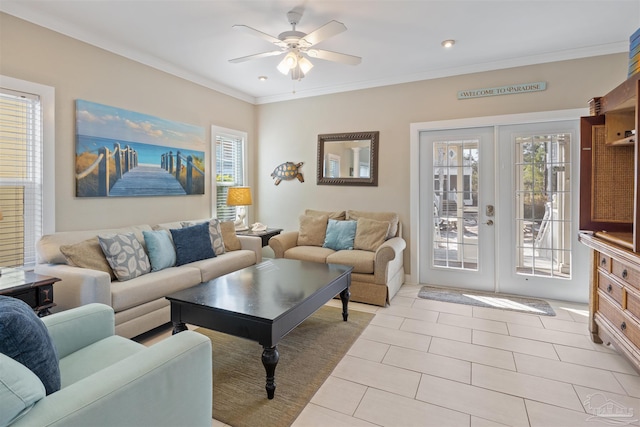 tiled living room with crown molding, french doors, and ceiling fan