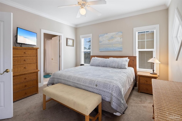 carpeted bedroom featuring crown molding and ceiling fan