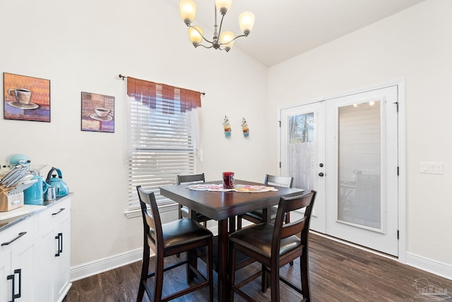 dining room featuring baseboards, a notable chandelier, and dark wood-type flooring
