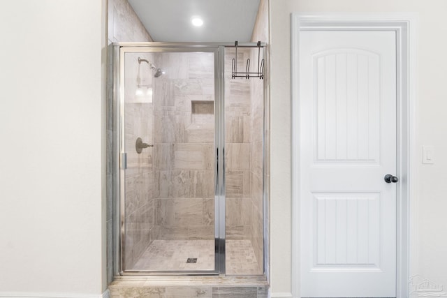 bathroom featuring a shower stall
