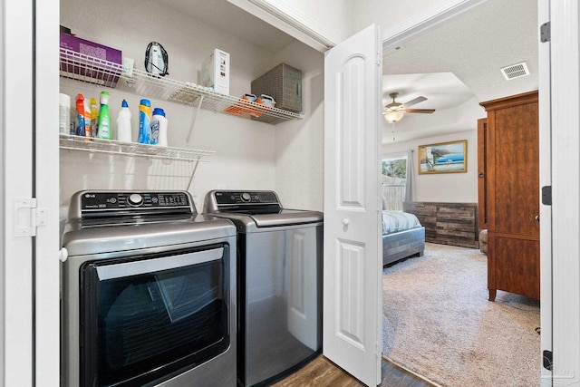 laundry area with ceiling fan, laundry area, visible vents, washing machine and clothes dryer, and carpet flooring