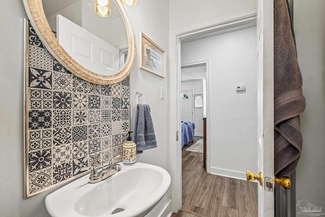 bathroom featuring sink and hardwood / wood-style floors