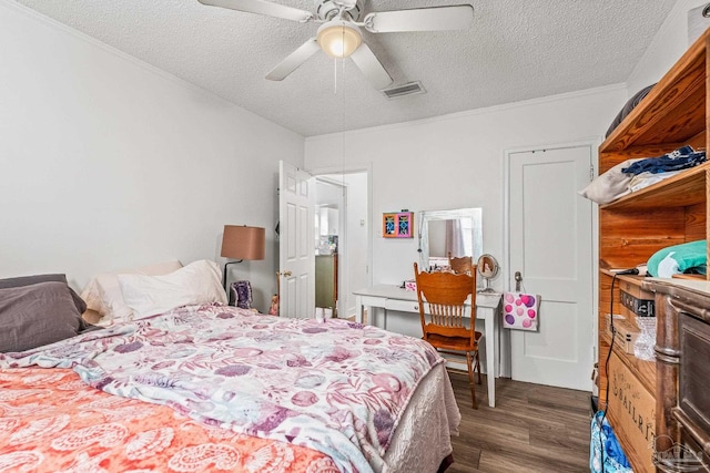 bedroom with ceiling fan, a textured ceiling, dark hardwood / wood-style flooring, and ornamental molding