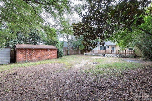 view of yard featuring a wooden deck