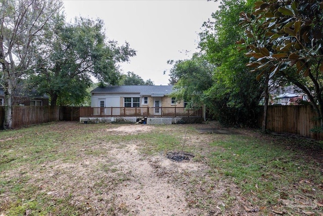 view of yard with a wooden deck