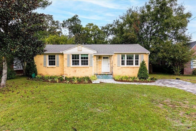 ranch-style home with a front yard