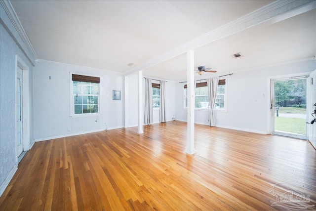 spare room featuring light hardwood / wood-style floors, plenty of natural light, crown molding, and ceiling fan