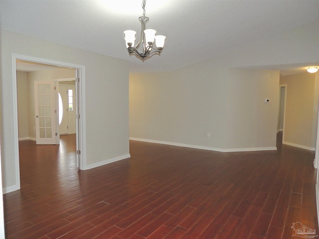 4814 Belvedere Cir, Pace, FL 32571 - spare room featuring a chandelier and dark wood-style flooring