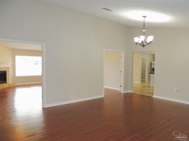4814 Belvedere Cir, Pace, FL 32571 - unfurnished room with a chandelier, high vaulted ceiling, a fireplace, and wood finished floors