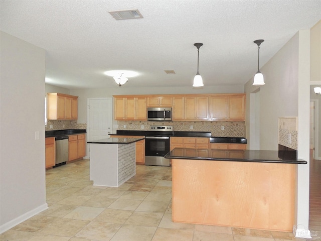 4814 Belvedere Cir, Pace, FL 32571 - kitchen with stainless steel appliances, tasteful backsplash, dark countertops, light brown cabinetry, and a peninsula