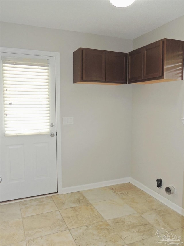 4814 Belvedere Cir, Pace, FL 32571 - laundry area with baseboards and cabinet space