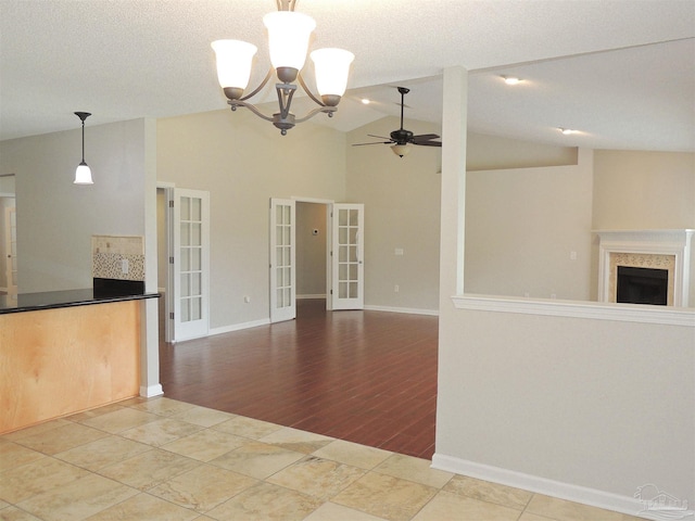 4814 Belvedere Cir, Pace, FL 32571 - kitchen featuring ceiling fan, a chandelier, open floor plan, vaulted ceiling, and french doors