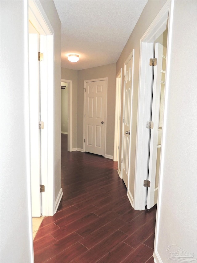 4814 Belvedere Cir, Pace, FL 32571 - hallway featuring dark wood-type flooring and baseboards