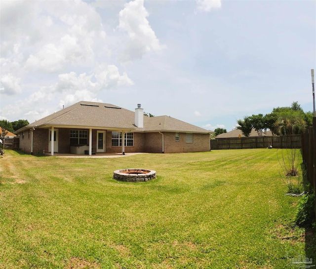 4814 Belvedere Cir, Pace, FL 32571 - back of property with an outdoor fire pit, a patio area, and a chimney