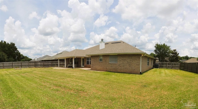 4814 Belvedere Cir, Pace, FL 32571 - rear view of property with a fenced backyard, brick siding, a patio area, and a chimney