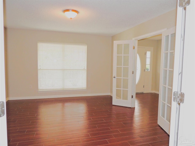 4814 Belvedere Cir, Pace, FL 32571 - spare room with french doors and dark wood-style flooring