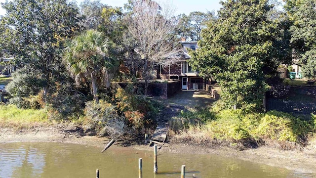 birds eye view of property featuring a water view