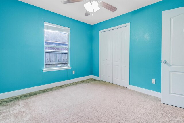 2546 Stormy Cir, Navarre, FL 32566 - unfurnished bedroom with carpet floors, a ceiling fan, baseboards, and a closet