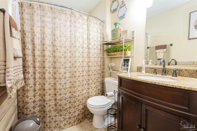 2546 Stormy Cir, Navarre, FL 32566 - full bathroom featuring vanity, toilet, and a shower with curtain