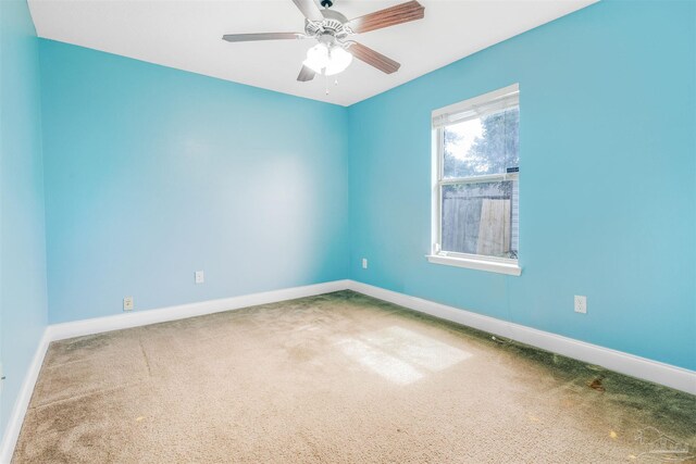 2546 Stormy Cir, Navarre, FL 32566 - carpeted spare room with baseboards and ceiling fan