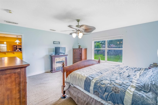 2546 Stormy Cir, Navarre, FL 32566 - carpeted bedroom with visible vents, baseboards, and ceiling fan