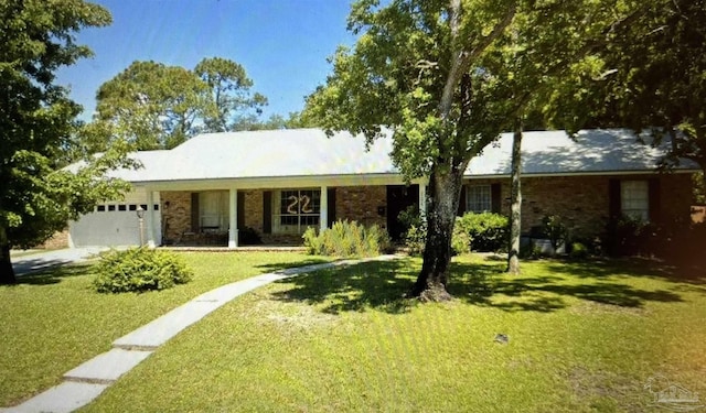 ranch-style home with a front yard and a garage