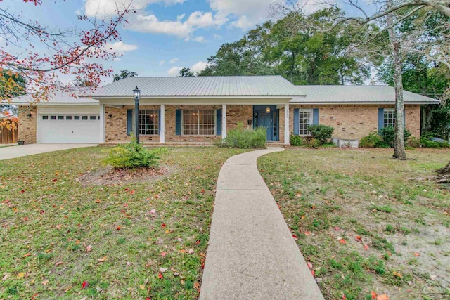 single story home with a front yard and a garage