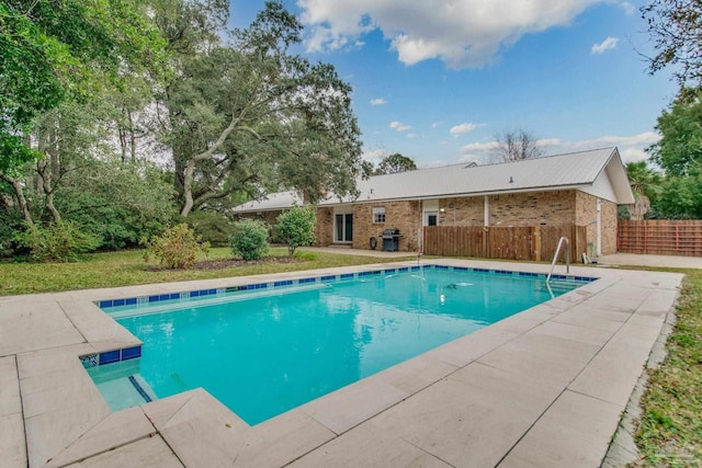 view of pool featuring area for grilling