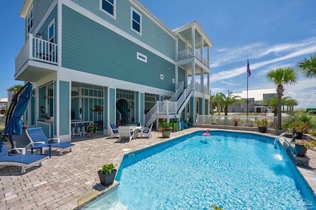 view of swimming pool featuring a patio