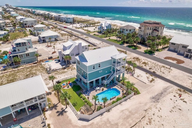 birds eye view of property with a view of the beach and a water view