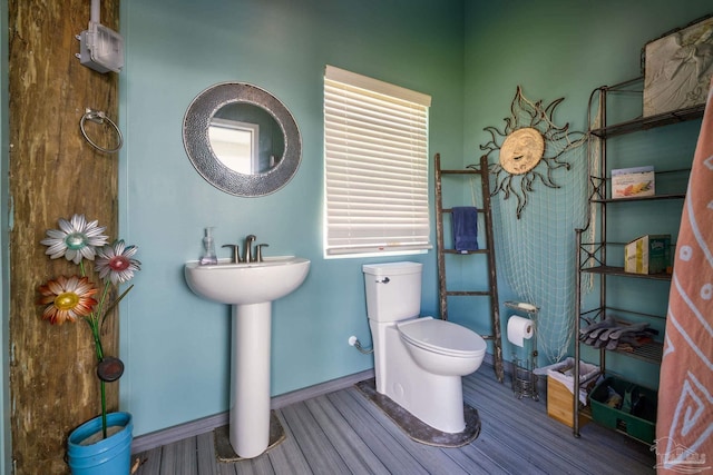 bathroom featuring toilet and hardwood / wood-style floors