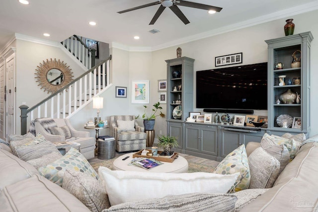 living room featuring ceiling fan and ornamental molding