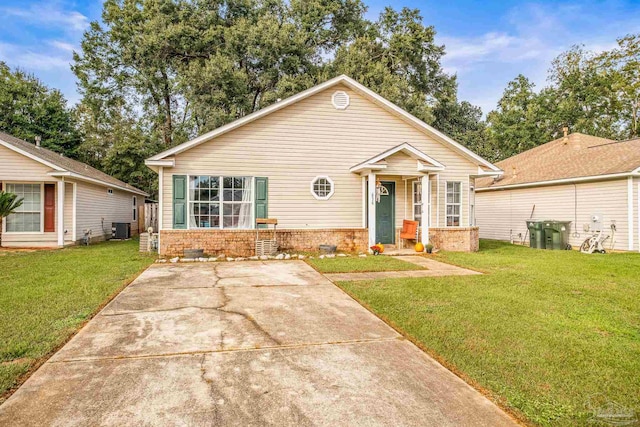 bungalow-style home featuring central air condition unit and a front yard