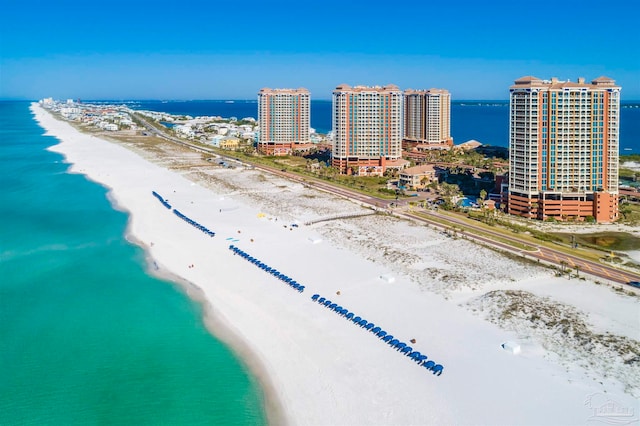 bird's eye view featuring a view of the beach and a water view