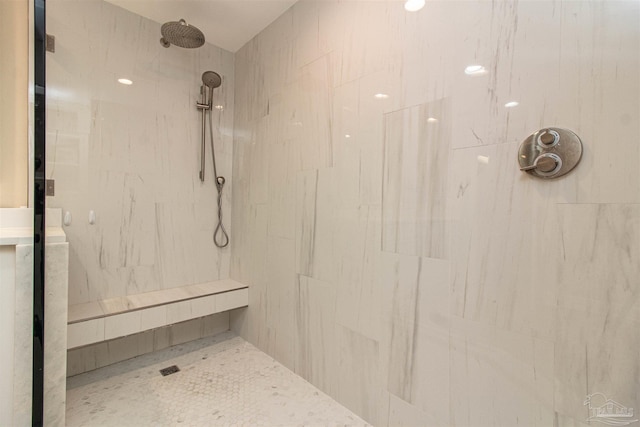 bathroom featuring a tile shower