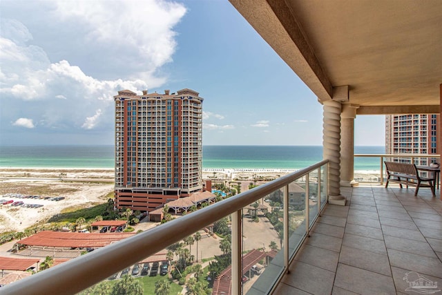 balcony with a beach view and a water view