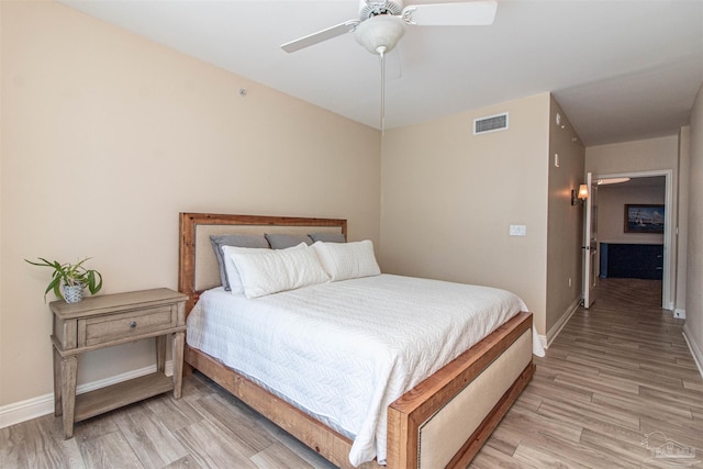 bedroom with ceiling fan and light wood-type flooring